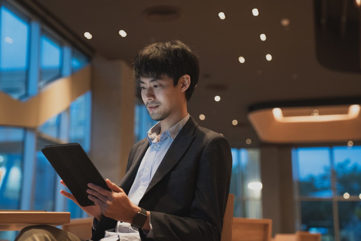 A man looking at a tablet