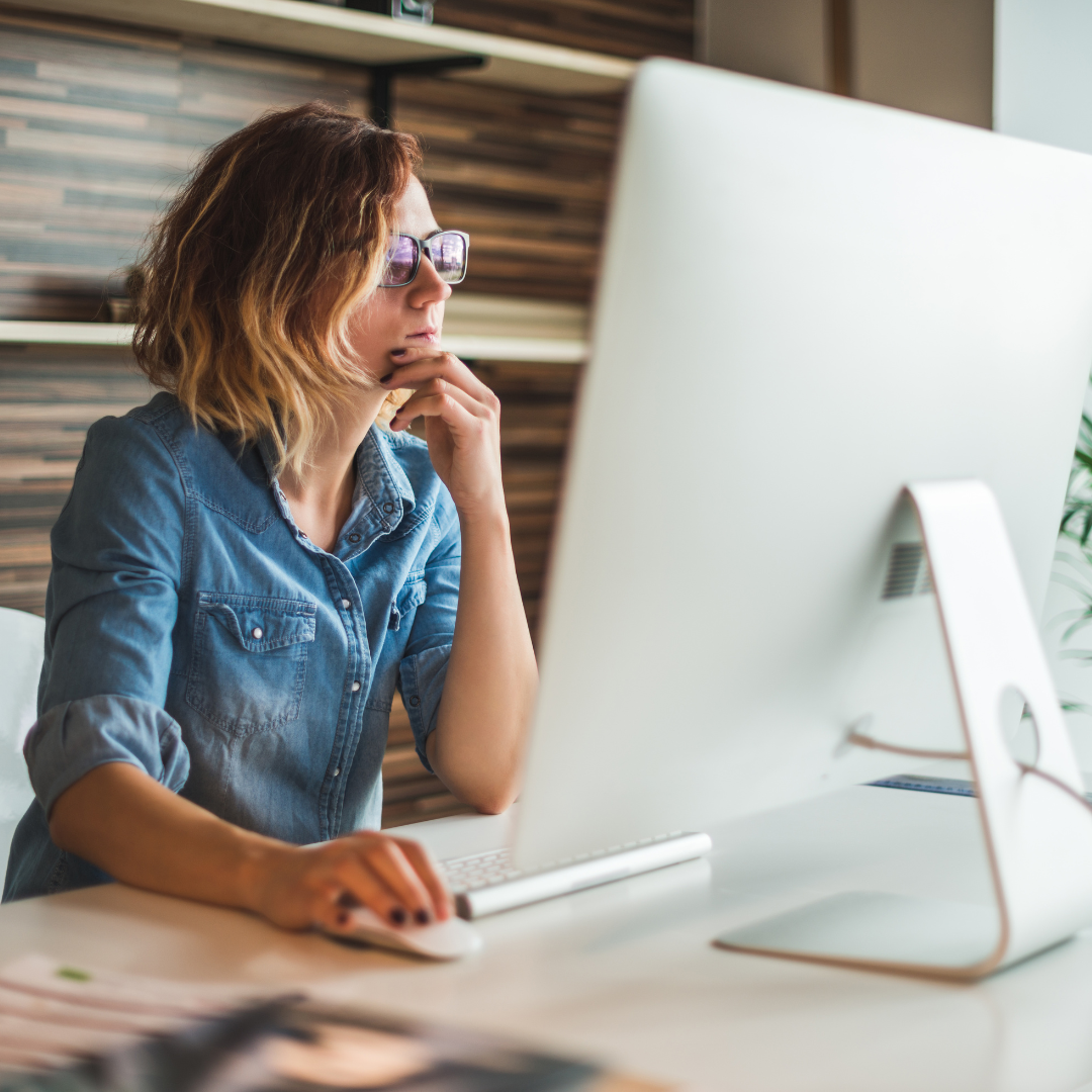 woman looking at computer