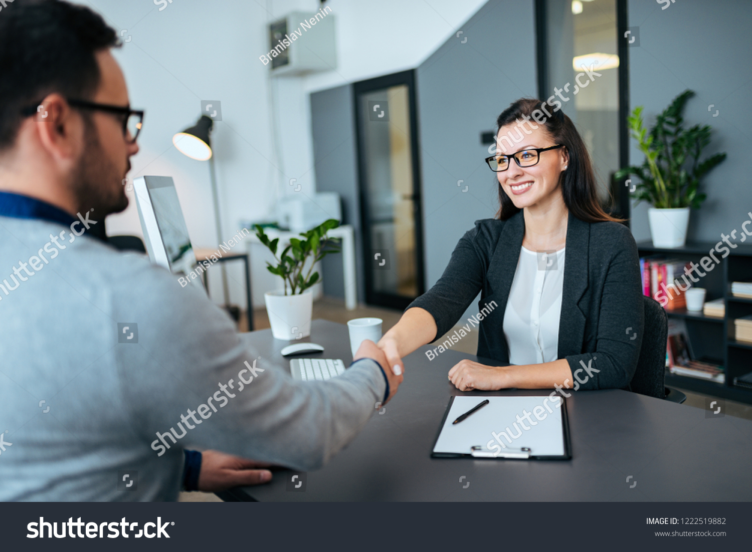stock-photo-business-people-shaking-hands-in-modern-office-businesss-agreement-partnership-or-job-interview-1222519882